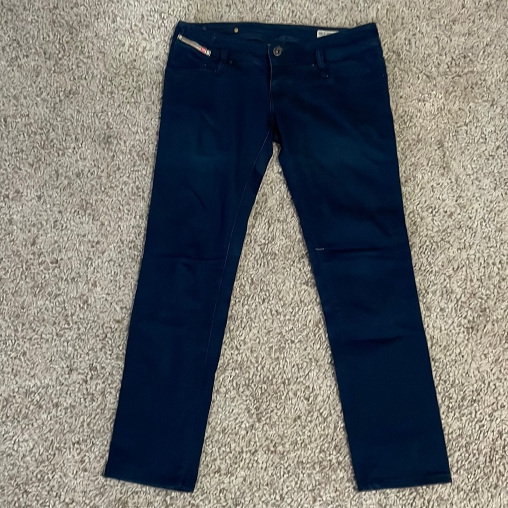 These are a dark blue, stretch denim size 29, 30 length in the low rise Matic